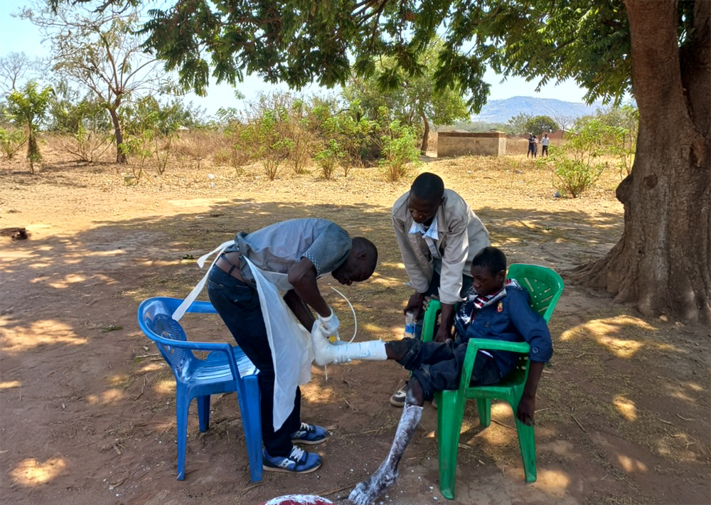 A patient being treated by the outreach service