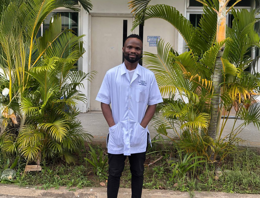 Yohane Phiri standing outside a hospital building