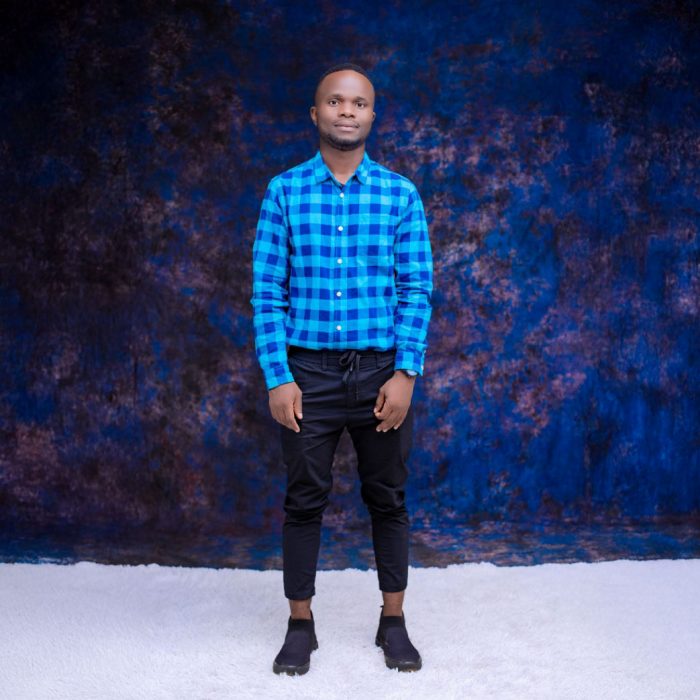 Yohane Phiri standing against a studio background